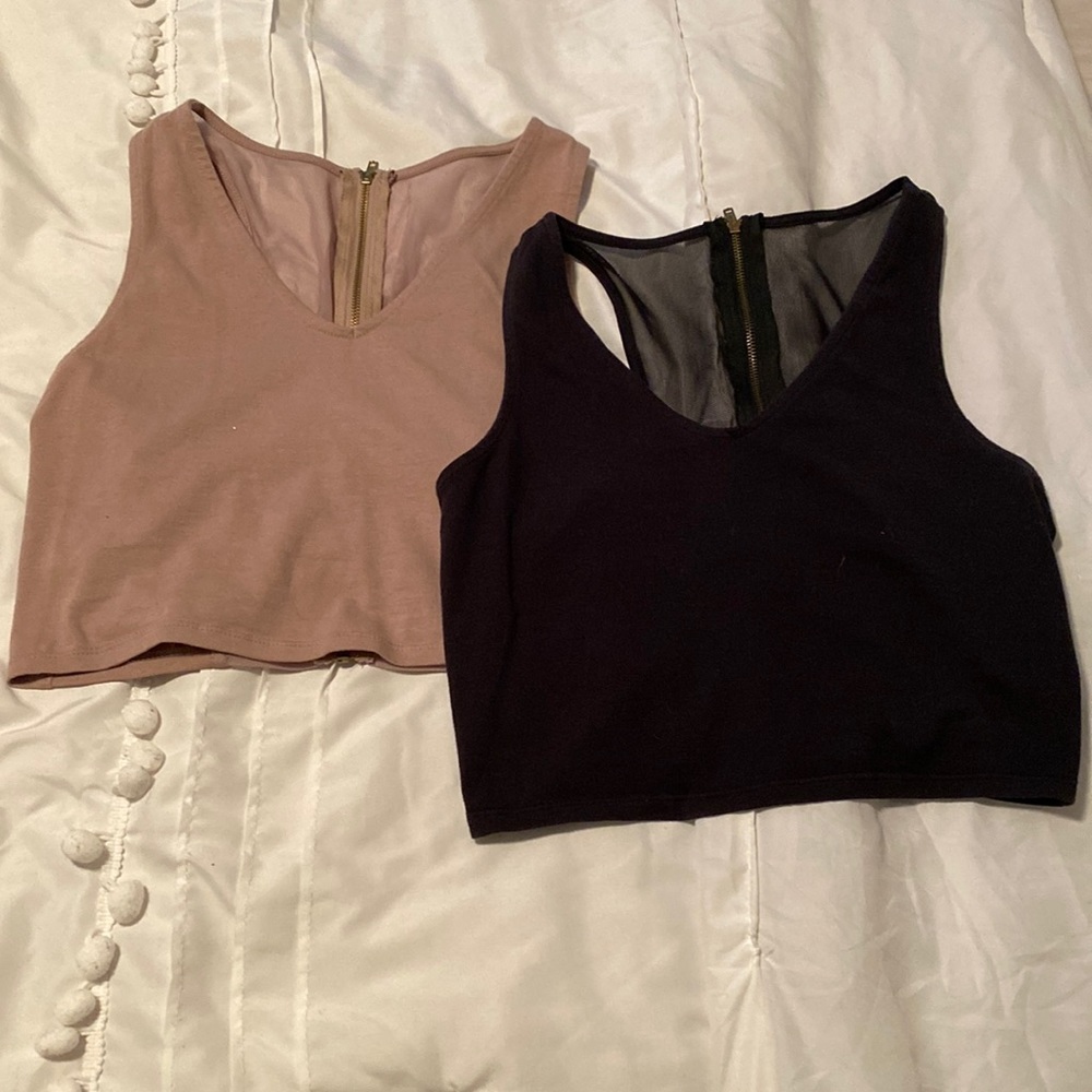 2 crop tops . Mesh inserts in back .